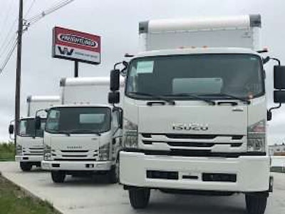 Isuzu commercial trucks parked on lot
