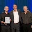 Dean Vicha, NationaLease president (center), presented the Exceptional Service Award to 12 NationaLease members. Shown above are recipients Randy Johnson (right) and Eric Poppe (left), both of Kirk NationaLease.