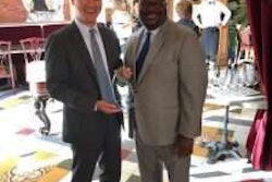 President Thomas Lawson (right) presents award to Seung Baik, Agility’s chief legal officer and head of government relations.