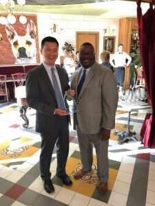 President Thomas Lawson (right) presents award to Seung Baik, Agility’s chief legal officer and head of government relations.
