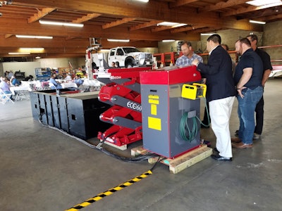Matthias Lennemann, heavy-duty inground lift sales manager, shows the workings of a Stertil-Koni EcoLift.
