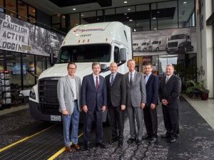 DTNA Senior Vice President of Operations and Specialty Vehicles Jeff Allen (left to right), North Carolina Governor Roy Cooper, DTNA CEO Roger Nielsen, Freightliner Trucks Vice President of Sales Bob Correll, Cleveland Truck Manufacturing Plant Manager Erik Johnson and Chairman of Cargo Transporters John Pope