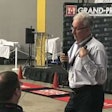 George Arrants, ASE Education Alliance manager for medium/heavy duty trucks, presents Wednesday at the Isuzu North American technician competition.