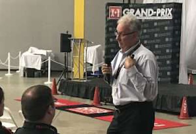 George Arrants, ASE Education Alliance manager for medium/heavy duty trucks, presents Wednesday at the Isuzu North American technician competition.