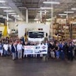 Employees celebrating the 50,000th gasoline-powered Isuzu N-Series truck