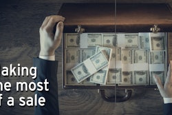 Man opening brief case filled with money