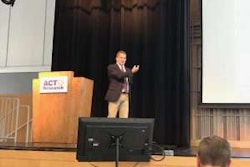 ACT Vice President Steve Tam speaks Tuesday at the company’s biannual seminar in Columbus, Ind.
