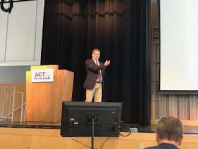 ACT Vice President Steve Tam speaks Tuesday at the company’s biannual seminar in Columbus, Ind.