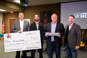 The Larson Group’s Chief Financial Officer Mike Headley, Director of Human Resources Nathan Conn, Chief Operating Officer Kory Larson and Convoy of Hope’s Chief Operating Officer Keith Boucher.