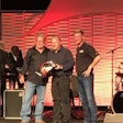 Steven Brain, a medium-duty technician at Rush Truck Center’s Dallas facility, is awarded the top prize by Rusty Rush and Clint Bowyer at the 13th annual Rush Enterprises Tech Skills Rodeo Tuesday in San Antonio.
