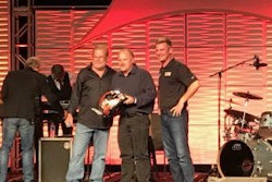 Steven Brain, a medium-duty technician at Rush Truck Center’s Dallas facility, is awarded the top prize by Rusty Rush and Clint Bowyer at the 13th annual Rush Enterprises Tech Skills Rodeo Tuesday in San Antonio.