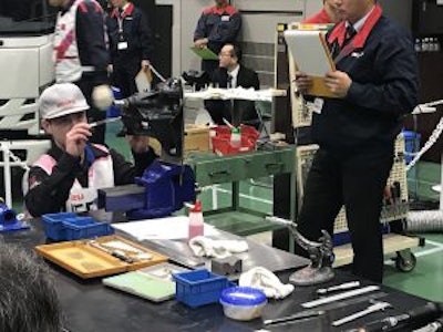 Matthew Bertagnoli, of Lynch Isuzu Truck, rebuilding a steering box.