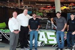 Barry Wilson (left to right) and Lance Eskridge of TruNorth, NASCAR driver Ross Chastian, Paul Teutul Jr. of Paul Jr. Designs and NASCAR driver Reid Wilson