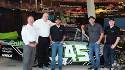 Barry Wilson (left to right) and Lance Eskridge of TruNorth, NASCAR driver Ross Chastian, Paul Teutul Jr. of Paul Jr. Designs and NASCAR driver Reid Wilson