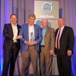 General Truck Sales dealer principal Steve Bassett (left of center) receives the award for the 2018 Volvo Trucks North American Dealer of the Year from (left to right) Peter Voorhoeve, president, Volvo Trucks North America; Bill Hubbartt, regional vice president, central U.S. region; Bruce Kurtt, senior vice president of U.S. sales for Volvo Trucks North America.