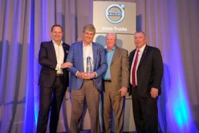 General Truck Sales dealer principal Steve Bassett (left of center) receives the award for the 2018 Volvo Trucks North American Dealer of the Year from (left to right) Peter Voorhoeve, president, Volvo Trucks North America; Bill Hubbartt, regional vice president, central U.S. region; Bruce Kurtt, senior vice president of U.S. sales for Volvo Trucks North America.