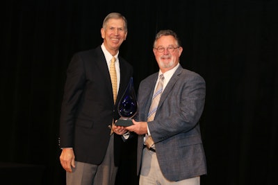 Axalta’s Bryan Shelton receiving his award from American Chemistry Council President and CEO Cal Dooley.