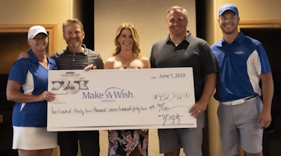 Truck Center Companies CEO Trey Mytty presenting a check to Make-A-Wish