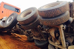 Overturned dump truck with frame twist