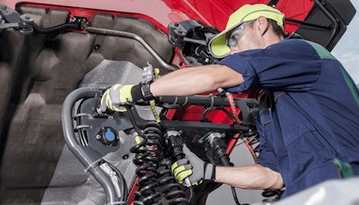 Technician adjusting hoses