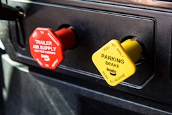 Red and yellow dash control valves for tractor protection and parking brakes.