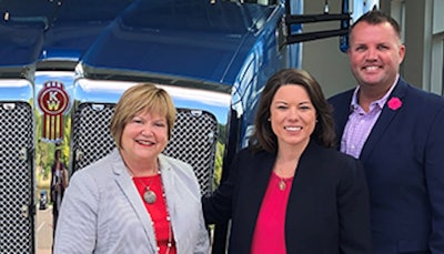 U.S. Rep. Angie Craig (center) meets with Kari Rihm (left), president of Rihm Family Companies, and J.B. Rihm, dealership vice president.