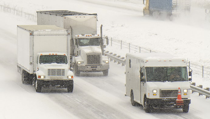 Trucks-on-highway-winter-min