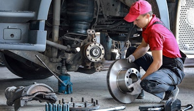 tech replacing disc brakes on steer axle