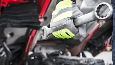 Technician with wrench in hand