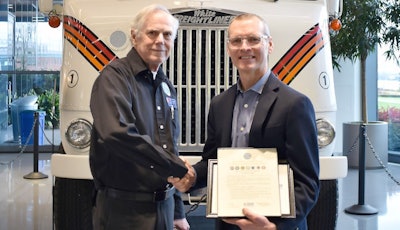 Jeffrey Thompson (right) receives the Employer Support for the Guard & Reserve Patriot Award from Bruce Thompson, Employer Support of the Guard and Reserve volunteer.