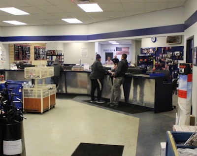 Teams of two check in orders to ensure all parts have been delivered at Royal Truck & Trailer.