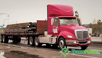 Image Of Truck Driving Down Road, With Trans Power Logo