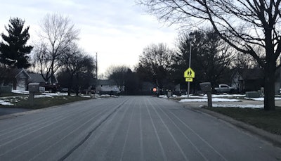 A deicing solution distributed on a road before a snowstorm.