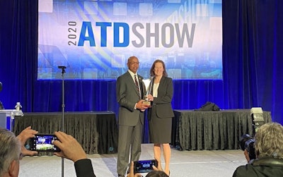 Oscar Horton, president, Sun State International, is presented the 2020 ATD Dealer of the Year award by ATD Senior Director Barbara Robinson.