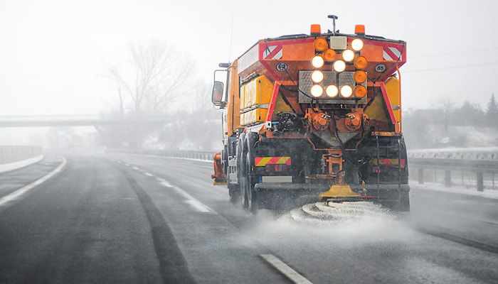 02.20.Truck salt deicing road