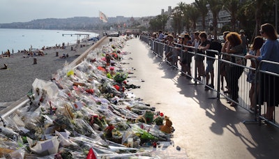 Flowers laid on a beach promenade in Nice, France, after 86 people were killed in a truck ramming attack in 2016.