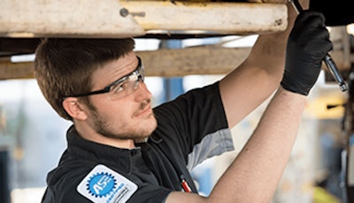 Ase Certified Technician Performing Repair