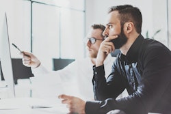 04.20.Young professionals look at computer-min