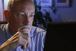 05.20.Man at computer laptop online-min