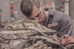 Tech-working-on-truck-SourceDTNA-min