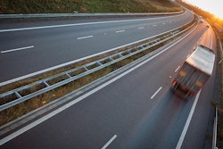 06.20.Truck on empty road driving