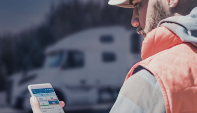 Volvo and Mack have expanded their partnerships with Geotab to provide insights to fleet managers and drivers through a cloud-based platform. A professional driver changes duty status on the Geotab app.