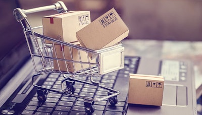 toy cart and boxes on top of laptop keyboard