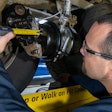 Bendix technician measures brake stroke in a wheel end
