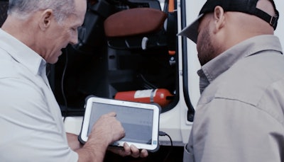 Two Men Using Decisiv Sme On Tablet Computer