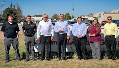 The Palmer Leasing Group leadership stands together with the 2019 U.S. Kenworth Franchise of the Year award.