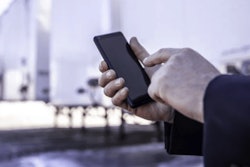 Technology-phone-in-front-of-trailer-700×400-min