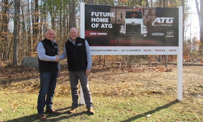 Advantage Truck Group co-founders Kevin Holmes and Kevin McDevitt pose in front of a future Advantage Truck Group facility in Massachusetts.