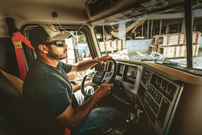 driver inside cab of truck