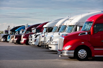 Semi-trucks parked in a row